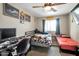 This bedroom features two cozy beds, neutral tones, and a ceiling fan for added comfort and relaxation at 1030 E Desert Moon Trl, San Tan Valley, AZ 85143