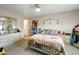 Serene bedroom with natural light, featuring neutral walls, and a comfortable bed, creating a peaceful retreat at 1030 E Desert Moon Trl, San Tan Valley, AZ 85143