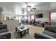 Open-concept living room with dining area featuring a ceiling fan, and ample space for both relaxation and dining at 1030 E Desert Moon Trl, San Tan Valley, AZ 85143