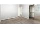 Carpeted floor bedroom with walk in closet access, with lots of light and bright ambience at 10452 E Florian Ave, Mesa, AZ 85208