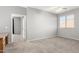 Bright bedroom features a ceiling fan, neutral walls and carpet floors at 10452 E Florian Ave, Mesa, AZ 85208