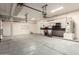 Spacious garage featuring ample storage space, pegboard for tools, and clean concrete floors for easy maintenance at 10452 E Florian Ave, Mesa, AZ 85208
