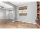 Neutral living area featuring tile floors, bright walls and a modern ceiling fan at 10452 E Florian Ave, Mesa, AZ 85208