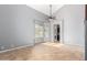 Spacious living room with tile floors, high ceilings, and natural light at 10452 E Florian Ave, Mesa, AZ 85208
