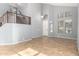 Spacious living room with tile floors, high ceilings, and natural light at 10452 E Florian Ave, Mesa, AZ 85208