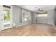 Spacious living room with tile floors, natural light, and backyard pool access at 10452 E Florian Ave, Mesa, AZ 85208