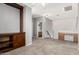 Loft with carpeted floor, built-in shelving, and adjacent bathroom at 10452 E Florian Ave, Mesa, AZ 85208