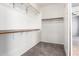 Ample storage is found in this walk-in closet with built-in shelving and rods at 10452 E Florian Ave, Mesa, AZ 85208