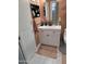 Bathroom with a white vanity, modern lighting, and neutral walls at 10624 W Oakmont Dr, Sun City, AZ 85351