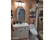 Bathroom with a white vanity, modern lighting, and neutral walls and tiled shower at 10624 W Oakmont Dr, Sun City, AZ 85351