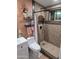 Renovated bathroom featuring new tiled shower with glass panel and modern fixtures at 10624 W Oakmont Dr, Sun City, AZ 85351