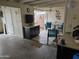 Garage with cabinets, tools, and doorway to outside patio seating area at 10624 W Oakmont Dr, Sun City, AZ 85351