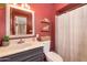 Bathroom with marble countertop vanity and storage shelves with a full shower at 1109 E 8Th St, Mesa, AZ 85203