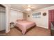 Cozy bedroom with neutral walls, a ceiling fan, and a comfortable bed at 1109 E 8Th St, Mesa, AZ 85203