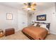 Inviting bedroom featuring a comfortable bed, closet, ceiling fan and rustic accents at 1109 E 8Th St, Mesa, AZ 85203