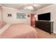 Well-lit bedroom featuring a ceiling fan, dresser, and a comfortable bed at 1109 E 8Th St, Mesa, AZ 85203