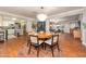 Elegant dining area featuring a chandelier, seating for four, and an open concept design connecting to the living spaces at 1109 E 8Th St, Mesa, AZ 85203