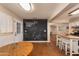 Spacious kitchen shows large chalk wall, white cabinets and island workspace near exterior access door at 1109 E 8Th St, Mesa, AZ 85203