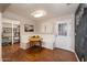 Bright breakfast nook featuring a built-in bench and table, located next to exterior door at 1109 E 8Th St, Mesa, AZ 85203