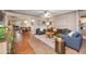 Inviting living room featuring stylish furniture, hardwood floors, and an open layout leading to the dining area at 1109 E 8Th St, Mesa, AZ 85203