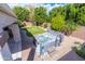 Aerial shot of a backyard with a patio, hot tub, desert landscaping, and pavers creating a private outdoor oasis at 11207 N 165Th Ave, Surprise, AZ 85388