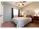 Cozy bedroom with neutral tones, ceiling fan, and natural light at 11207 N 165Th Ave, Surprise, AZ 85388