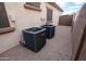 Exterior view of two AC units, installed on a gravel base at 11207 N 165Th Ave, Surprise, AZ 85388