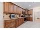 Well-equipped kitchen with custom cabinetry, sleek appliances, and tile backsplash at 11207 N 165Th Ave, Surprise, AZ 85388