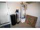 Utility room featuring a water heater and water softener at 11207 N 165Th Ave, Surprise, AZ 85388