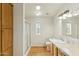 Well-lit bathroom features wood-look flooring, shower, and a vanity with a neutral countertop at 11596 W Sierra Dawn Blvd # 99, Surprise, AZ 85378