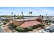 Community clubhouse featuring a red tile roof, well-manicured landscaping, and ample parking at 11596 W Sierra Dawn Blvd # 99, Surprise, AZ 85378