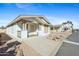 Inviting single-story home featuring desert landscaping and a covered front porch at 11596 W Sierra Dawn Blvd # 99, Surprise, AZ 85378