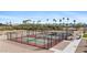 Aerial shot of well-maintained community pickleball courts surrounded by lush desert landscaping at 11596 W Sierra Dawn Blvd # 99, Surprise, AZ 85378