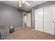 Bedroom with gray walls, closet and doorway to another room at 1165 E Erie St, Gilbert, AZ 85295