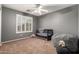 Bedroom featuring a crib, rocking horse and shuttered window at 1165 E Erie St, Gilbert, AZ 85295