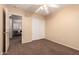 Cozy bedroom features a ceiling fan, closet and entry to another room at 1165 E Erie St, Gilbert, AZ 85295