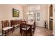 Formal dining room with elegant chandelier and traditional wood furniture at 1165 E Erie St, Gilbert, AZ 85295