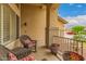 Cozy front porch area featuring comfortable wicker seating, potted plants, and stylish decor at 1165 E Erie St, Gilbert, AZ 85295