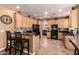 Well-appointed kitchen with dark countertops, ample cabinet space, and modern appliances at 1165 E Erie St, Gilbert, AZ 85295