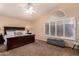 Serene main bedroom with vaulted ceiling, plantation shutters, and ample natural light at 1165 E Erie St, Gilbert, AZ 85295