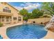 Large backyard pool with rock waterfall and slide at 1165 E Erie St, Gilbert, AZ 85295