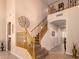 Grand staircase featuring carpeted steps, wooden railings, and neutral wall paint at 1165 E Erie St, Gilbert, AZ 85295