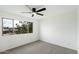 Bedroom with carpet, ceiling fan, and a large window offering natural light at 122 S Hardy Dr # 6, Tempe, AZ 85281