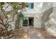 Inviting entryway, complete with a pathway leading up to the front door and a lush small tree at 122 S Hardy Dr # 6, Tempe, AZ 85281