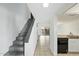 Hallway featuring a staircase, tile flooring and access to the kitchen at 122 S Hardy Dr # 6, Tempe, AZ 85281