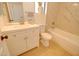 Bright bathroom featuring a tub/shower combo, a white vanity, and modern fixtures at 12722 W Diaz Dr, Arizona City, AZ 85123