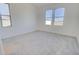 This bedroom is bright with 3 windows, neutral carpeting, and great natural lighting at 12722 W Diaz Dr, Arizona City, AZ 85123