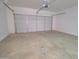 Spacious two car garage featuring a white door and white walls at 12722 W Diaz Dr, Arizona City, AZ 85123