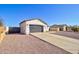 This single-Gathering home has an attached garage, desert landscaping and a paved driveway at 12722 W Diaz Dr, Arizona City, AZ 85123