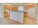 Cozy kitchen featuring oak cabinets, ample counter space, and a functional layout at 12722 W Diaz Dr, Arizona City, AZ 85123